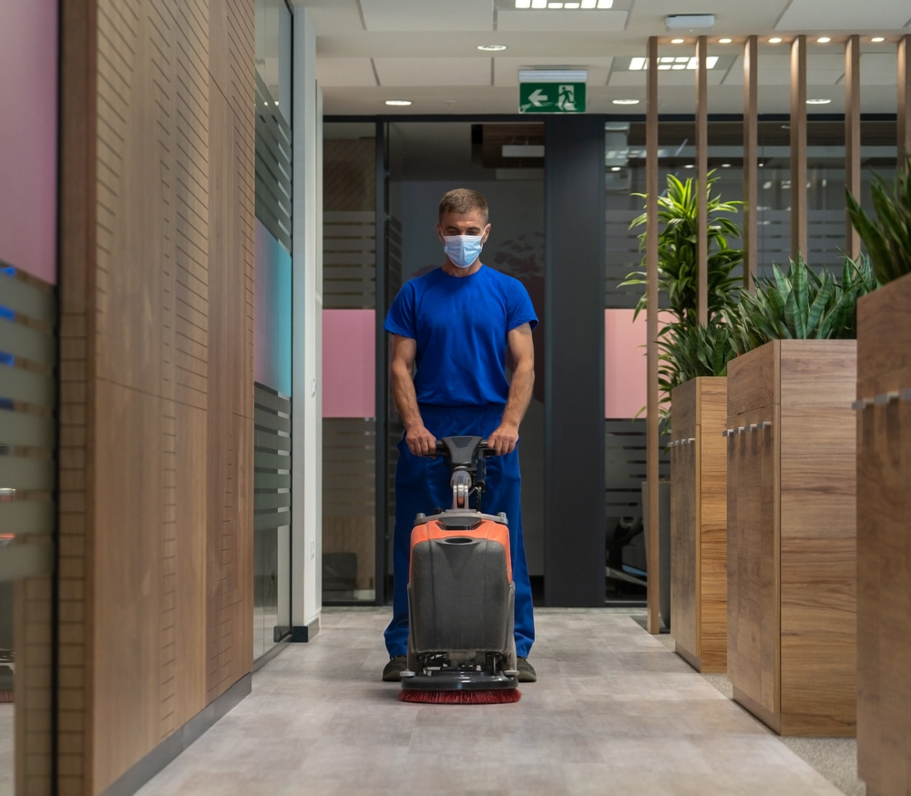 Person cleaning the inside of an office building